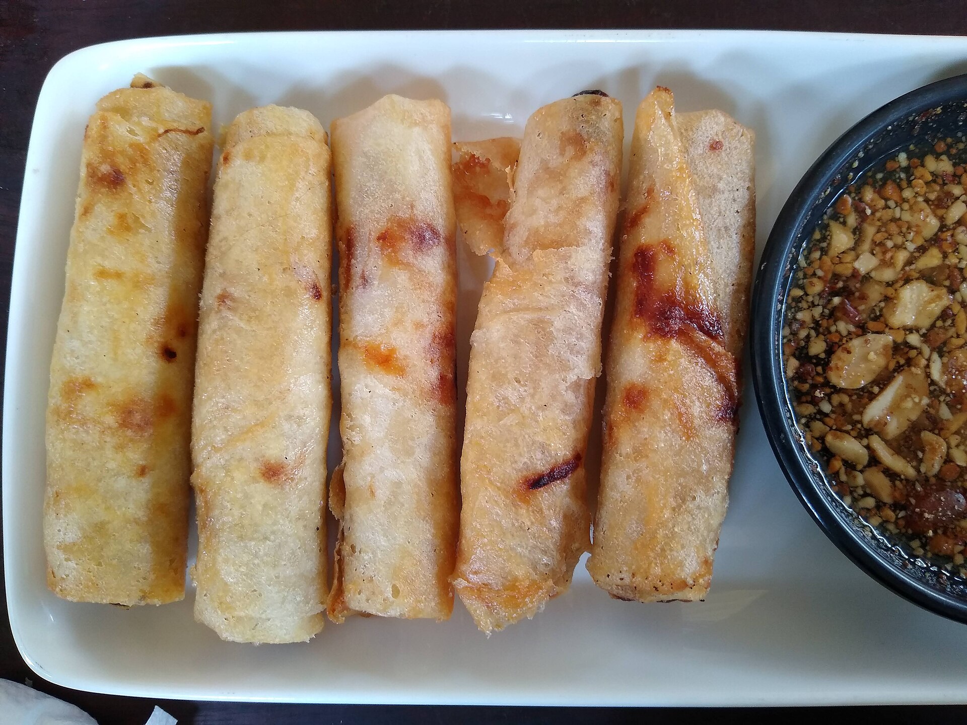 Spring rolls with a peanut dipping sauce at a restaurant in Siem Reap